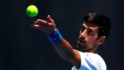 Novak Djokovic serves during a training session. David Gray / Reuters