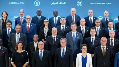 US Secretary of State Antony Blinken, bottom row centre, with counterparts and other government officials during the Global Coalition to Defeat ISIS ministerial meeting at the State Department in Washington on Monday. AFP