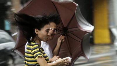 People brave to heavy rains and strong wind as typhoon Megi hits Hualien county, eastern Taiwan on September 27, 2016. Ritchie B Tongo/EPA