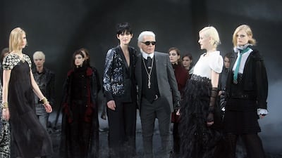 Lagerfeld with models after a show in 2011. Stephen Lock for The National