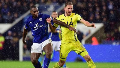 Tottenham Hotspur's Harry Kane, right, vies with Leicester City's English defender Wes Morgan during their English Premier League football match at King Power Stadium in Leicester, central England on December 26, 2014. AFP PHOTO / PAUL ELLIS