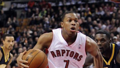 Toronto Raptors point guard Kyle Lowry, centre, drives the ball through the lane during the first quarter of a game against the Indiana Pacers at the Air Canada Centre. Mark Konezny / USA TODAY