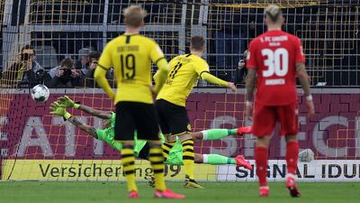 Dortmund's Marco Reus scores their third gpoal from the spot. EPA