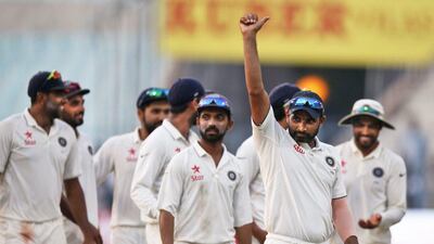 Indian cricketers acknowledge cheer from the crowd as India wins against New Zealand on the fourth day of the second cricket test match in Kolkata, India, Monday, Oct. 3, 2016. Saurabh Das / AP