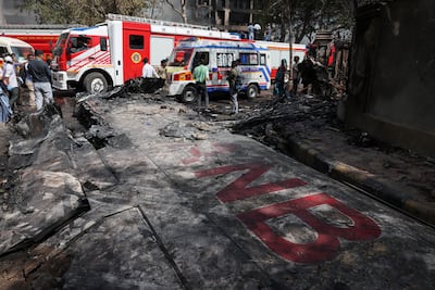The wreckage of an Air India Boeing 787 Dreamliner lies at the crash site in Ahmedabad, India, with part of its registration, 'VT-ANB', visible. Reuters