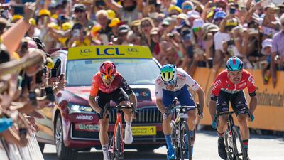 Victor Campenaerts, right, beats France's Matteo Vercher, centre, and Polish rider Michal Kwiatkowski, left, in a sprint finish. AP