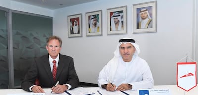 Abdul Younes, right, CEO of RTA's rail agency, signed a Memorandum of Understanding with John Cole, CEO of skyTran. Courtesy RTA