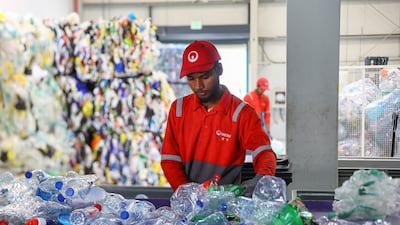 An employee sorts recyclable plastics at a warehouse and sorting facility, in Dubai, on March 7. Reuters