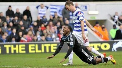 Chelsea's Daniel Sturridge, front, is brought down in the penalty area after being fouled by QPR's Clint Hill, resulting in the match-winning penalty.