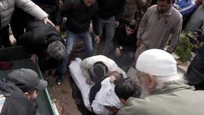 Mourners bury Abdel Hamid Sidawi, 16, who was one of 14 people killed when two buildings collapsed in Lebanon's northern city of Tripoli on Sunday. The National