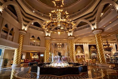 The hotel's golden lobby once featured in the 2011 film Mission Impossible — Ghost Protocol. Courtesy Jumeirah Zabeel Saray
