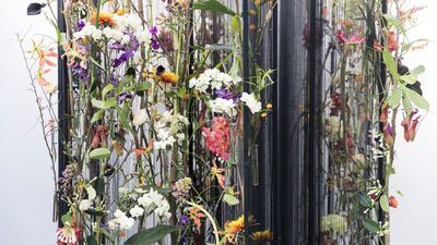 Alex Choi of South Korea took the second runner-up prize for his Dubai interpretation, entitled Green Kingdom of the Black Desert, based on the concept that “under the bright sunlight, the silent desert blooms with green life”. His structure of bound black threads reflected the undulating form of the desert dunes and provided a backdrop for the floral aspect of the design. Reem Mohammed / The National