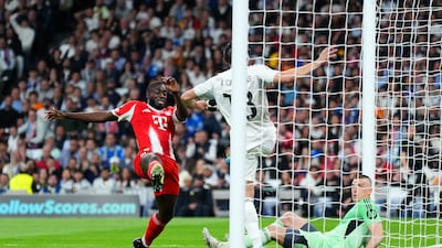 Real defender Alvaro Carreras clears a miss-hit shot from Bayern's Dayot Upamecano off line. Getty Images