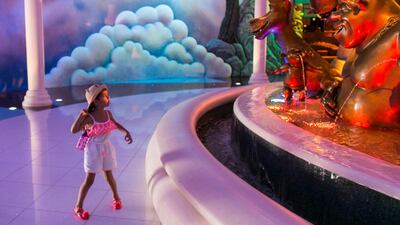 2. SHREK: A little girl is taken aback by the Shrek fountain at the DreamWorks zone at Motiongate in Dubai. Reem Mohammed / The National