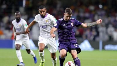 River Plate's Lucas Pratto and Al Ain's Mohammed Fayez battle during the game between River Plate and Al Ain in the Fifa Club World Cup.