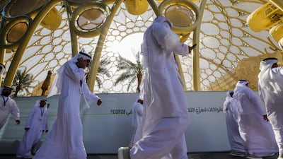 Participants arrive at the venue of Cop28 in Dubai in November 2023. AFP