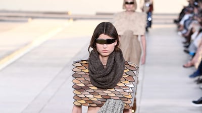 Scales resembling chain mail at the Louis Vuitton cruise 2023 show. AFP