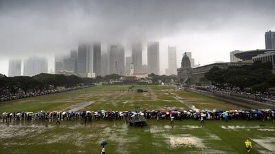 Four howitzers fired a 21-gun salute, air force fighter jets streaked over the island, with one peeling off in a ‘missing man’ formation, and navy patrol ships blasted horns. Tome White/EPA