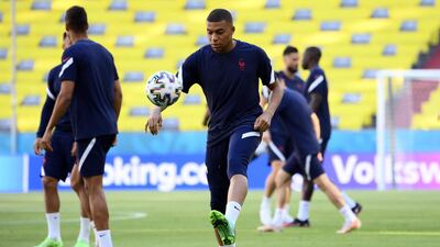 Kylian Mbappe plays with a ball during a training session at the Allianz Arena. AFP