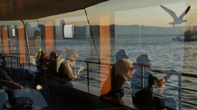 Passengers take a ride in a ferry crossing the Bosphorus in Istanbul, Turkey. AP