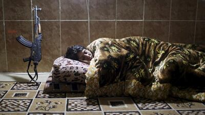 A PKK fighter sleeps at a base in Sinjar. Asmaa Waguih / Reuters