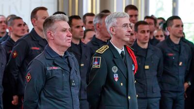 French General Jean-Claude Gallet, left, and Paris Prefect Didier Lallement listen to French President Emmanuel Macron addressing Paris Firefighters' brigade and security forces who took part at the fire extinguishing operations of the Notre Dame of Paris Cathedral fire, at the Elysee Palace in Paris, Thursday, April 18, 2019. France paid a daylong tribute Thursday to the Paris firefighters who saved the internationally revered Notre Dame Cathedral from collapse and rescued many of its treasures. AP
