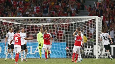 Santi Carzola of Arsenal celebrates after scoring his side's second goal in their Asia Trophy final triumph over Everton on Saturday. Stanley Chou / Getty Images
