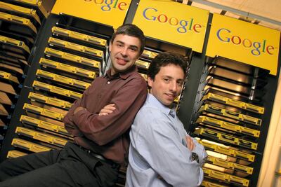 Larry Page, left, and Sergey Brin, pose inside the server room at Google's campus headquarters in Mountain View. They founded the company in 1998. Getty