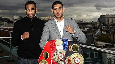 Amir Khan, right, puts his titles on the line against Lamont Peterson in Washington DC, the challenger's hometown. Khan wants to push this fight by asking the US president Barack Obama to attend at ringside.