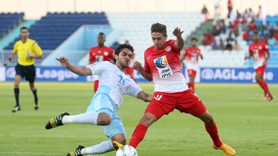 Baniyas, in white, played well but fell to a lucky strike from Al Jazira, in red, at the end. Shadi Malkawi / Al Ittihad