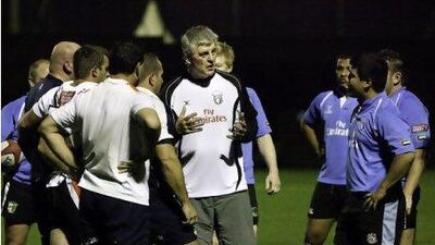 Duncan Hall talks to the UAE national team about his plans during a practice.