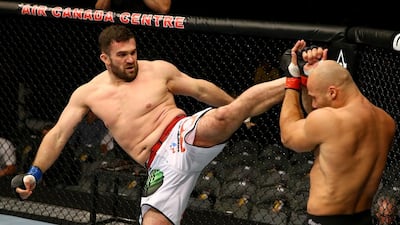 Daniel Omielanczuk, left, considers himself a well-rounded fighter but prefers muay Thai style the most. Al Bello / Getty Images