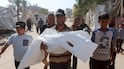 A mourner carries the body of Palestinian girl Rateel Al-Balawi, who was killed in an Israeli strike on a tent, according to medics, during her funeral in Khan Younis, in the southern Gaza Strip, July 30, 2026. REUTERS / Ramadan Abed