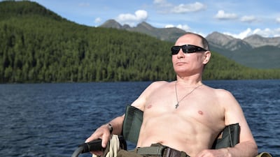 Mr Putin rests after fishing during a mini-break in the Siberian Tyva region. Alexei Nikolsky / Sputnik, Kremlin Pool Photo via AP.