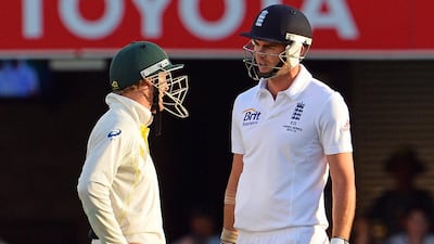 A look back to November 24, 2013: England's batsman James Anderson and Australian fielder George Bailey, left, exchange words during Day 4 of the first Ashes match between England and Australia at the Gabba Cricket Ground in Brisbane. Australia's former spin bowler Shane Warne says a threat by James Anderson to punch debutant George Bailey sparked the furious reaction by Australian skipper Michael Clarke in the first Test against England. Saeed Khan / AFP