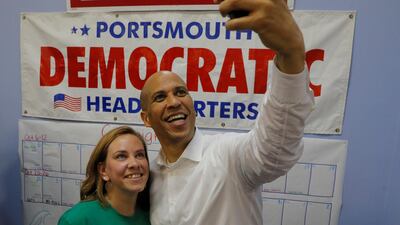 US Senator Cory Booker (D-NJ) takes a selfie after encouraging volunteer campaign canvassers ahead of the midterm elections in Portsmouth, New Hampshire, US. Reuters