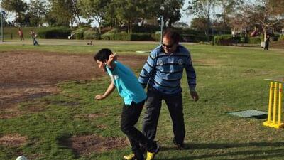 Syed Sajid plays ball with his son, Syed Abbas, 11.