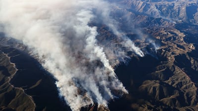 Smoke from the Palisades wildfires rises from the hills over Los Angeles on January 10. EPA