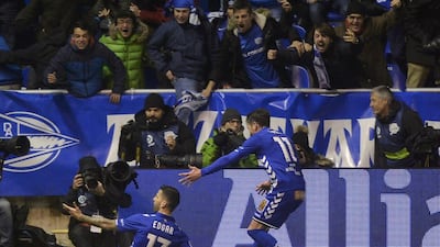 Alaves' Edgar Mendez, left, celebrates after scoring a goal with teammate Ibai Gomez against Celta Vigo. Vincent West / Reuters