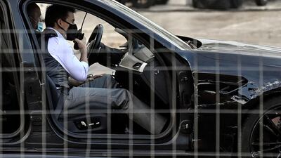 Tom Cruise wears a face mask during the shooting of 'Mission: Impossible 7' at Piazza Venezia in Rome, Italy on November 29, 2020. EPA