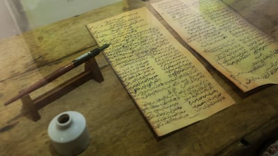 His quill and ink bottle