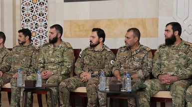 Sayf Boulad, centre, commander of the Hamzat Division militia group, is among those placed under UK sanctions. Photo: Sana