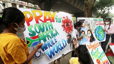 Indian students apply the finishing touches to paintings created to raise awareness of the variant in Mumbai. Reuters