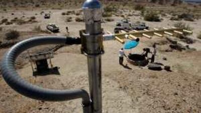An antenna stands on a rise above an earthquake monitoring well powered by a solar electric panel as scientists from the US Geological Survey investigate the San Andreas Fault in a canyon near Thermal, California.