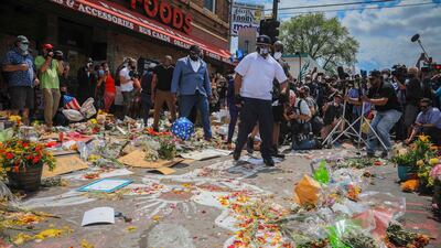Terrence Floyd, centre, at the spot in the intersection of 38th Street and Chicago Avenue, Minneapolis, where his brother George Floyd died while in police custody, Monday June 1, 2020. AP