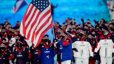 American speed skater Brittany Bowe and curler John Shuster lead their team during the opening ceremony. AP
