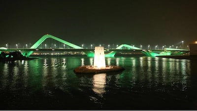 Sheikh Zayed Bridge is light up with green lights to celebrate Saudi National Day. Wam