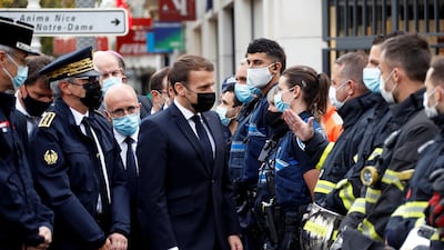 French President Emmanuel Macron visits the scene of a reported knife attack at Notre Dame church in Nice. Reuters