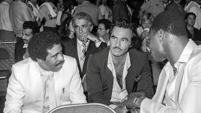 Comedian Richard Pryor, left, and Burt Reynolds chat at the Sugar Ray Leonard-Thomas Hearns middleweight title boxing match at Caesars Palace Las Vegas on September 16, 1981. Reuters