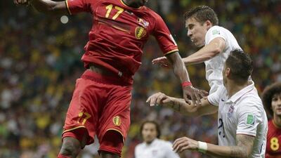 Belgium's Divock Origi heads the ball over United States' Matt Besler and Geoff Cameron, right, during the World Cup round of 16 soccer match between Belgium and the USA at the Arena Fonte Nova in Salvador, Brazil, Tuesday, July 1, 2014. AP Photo/Marcio Jose Sanchez